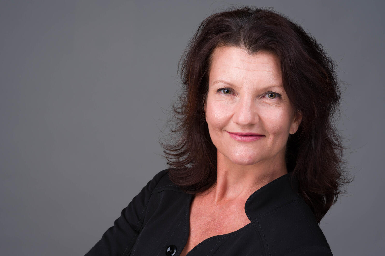 Professional business headshot of mature woman by Tampa photographer Sidney Oster