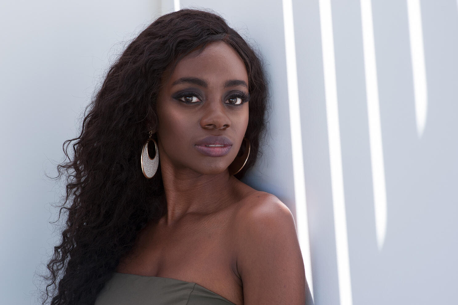 Personal Branding Personal branding beauty portrait and modeling headshot outside black female model shafts of sunlight by Tampa photographer Sidney Oster