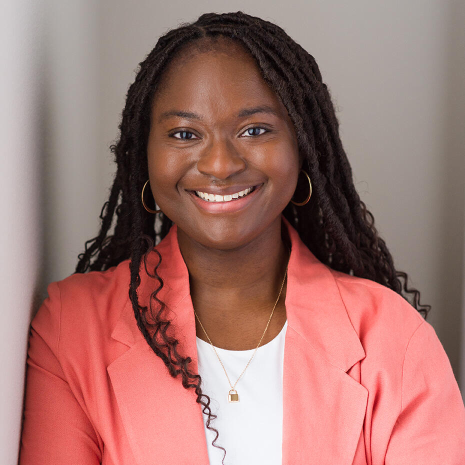 Professional Headshot Warm and friendly business headshot for young female black professional by Tampa Sidney Oster Photography