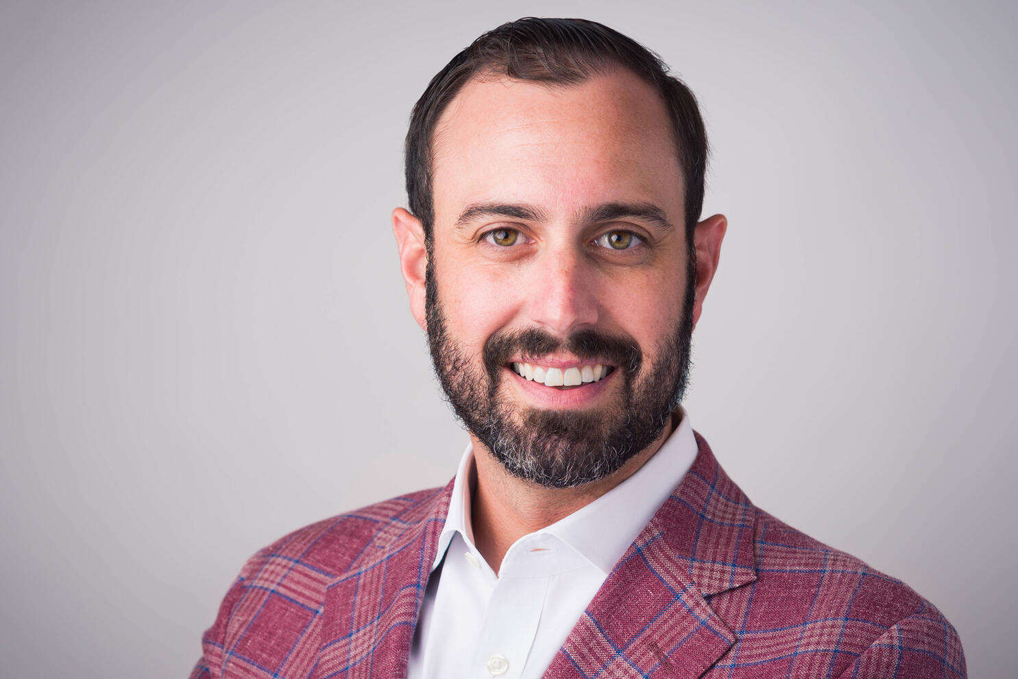 Professional executive headshot of man in plaid blazer by Tampa photographer Sidney Oster
