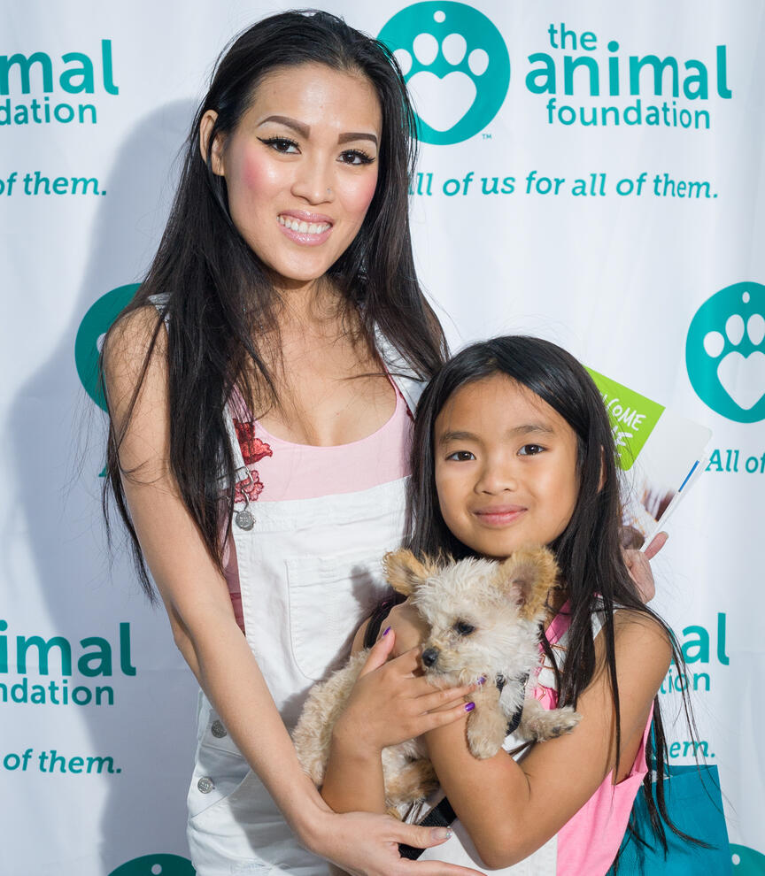 Mother and and daughter with a dog at The Animal Foundation Best In Show event